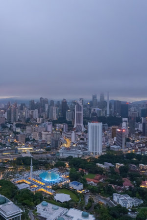 Low clouds drape over the city, creating a serene atmosphere.の写真素材