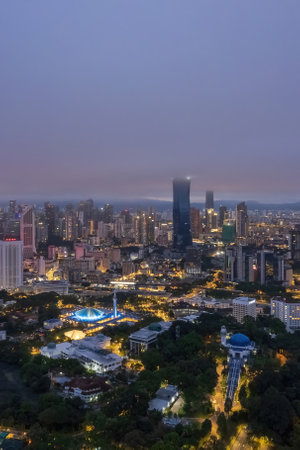 Low clouds drape over the city, creating a serene atmosphere.の写真素材