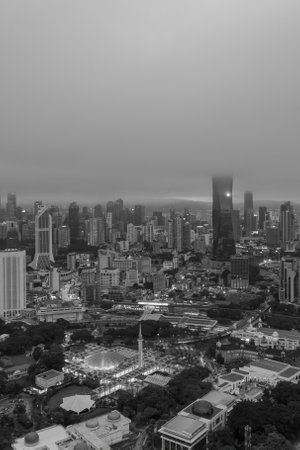 Low clouds drape over the city, creating a serene atmosphere.の写真素材