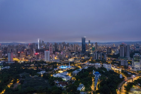Low clouds drape over the city, creating a serene atmosphere.の写真素材