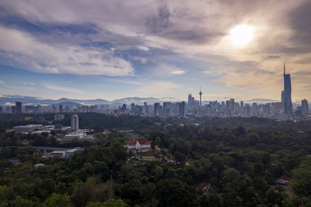 Sunrise paints the Kuala Lumpur cityscape, a breathtaking display of modern architecture.の写真素材