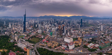 Aerial view of a vibrant city, revealing a complex tapestry of urban development and natural elements.の写真素材