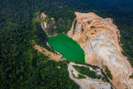 A high-angle perspective reveals the intricate network of roads and the quarry's impact on the...