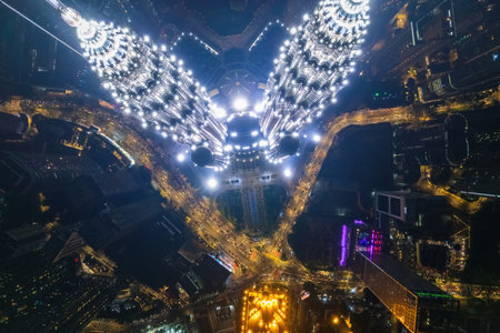 Urban sprawl unfolds beneath a canopy of night lights, revealing the density and energy of the city.