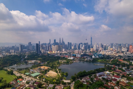 Panoramic view of Kuala Lumpur's urban sprawl, showcasing a dense collection of high-rise buildings...