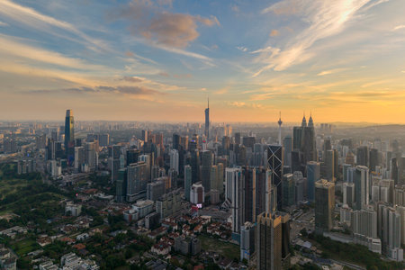 A panoramic shot highlighting the modern architecture of the central skyscraper amid numerous high-rise residential and commercial buildings.の写真素材