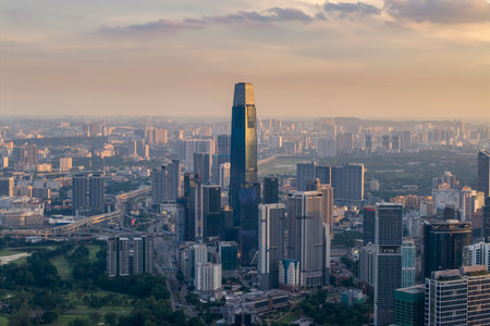 A panoramic shot highlighting the modern architecture of the central skyscraper amid numerous high-rise residential and commercial buildings.の写真素材