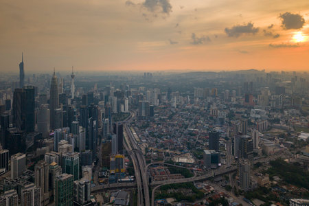A panoramic shot highlighting the modern architecture of the central skyscraper amid numerous high-rise residential and commercial buildings.の写真素材