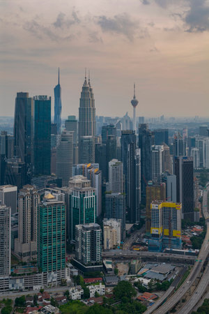A panoramic shot highlighting the modern architecture of the central skyscraper amid numerous high-rise residential and commercial buildings.の写真素材