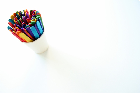 Multicolored ice cream sticks on the white background.の写真素材