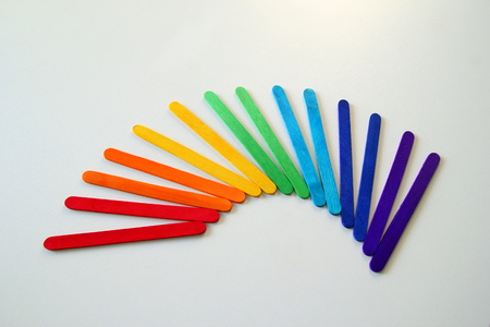 Multicolored ice cream sticks on the white background.の写真素材