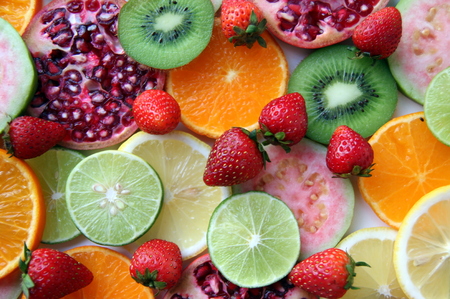 Mixed ripe and fresh fruits and berries close up for background.
