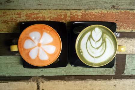 Travel to Ayutthaya, Thailand. The couple of colorful thai tea cups on the wooden background.の写真素材