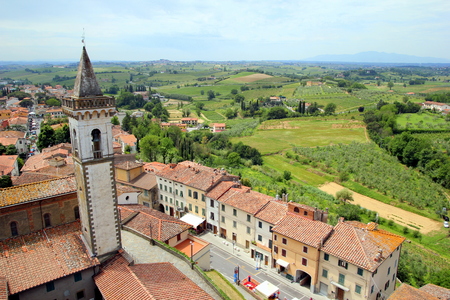 Travel to Vinci, Italy. The view on the city with red roofs and fields of Toscana.の写真素材