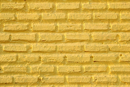 Yellow wall from bricks for background.の写真素材