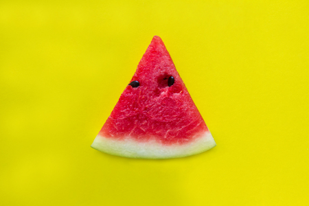 Red watermelon on yellow background.の写真素材