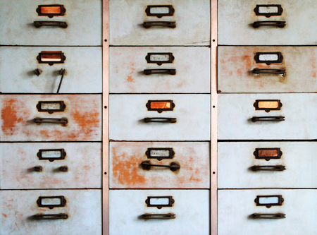 Old metal cabinet with drawers blue color with rusty.