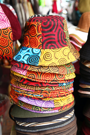 Colorful summer hats on a street market. Chiang Mai, Thailand.の写真素材