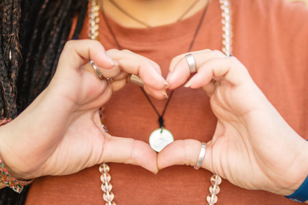 Hands of a woman in the shape of a heart.の写真素材