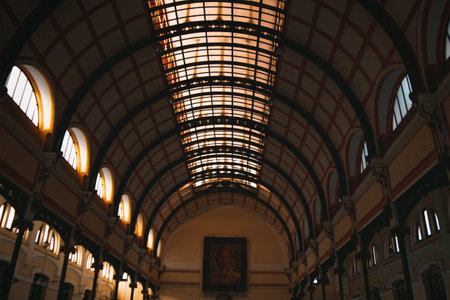 Architectural Marvel Interior View of a Grand Building Featuring Arches and Natural Light.の写真素材