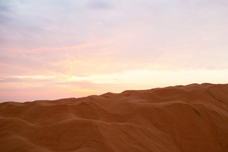 Serene Desert Landscape at Sunset Golden Sands and Pastel Skies. Mui Ne, Vietnam.の写真素材