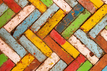 Colorful Brick Pavement in Herringbone Pattern A Vibrant and Textured Outdoor Surface.の写真素材