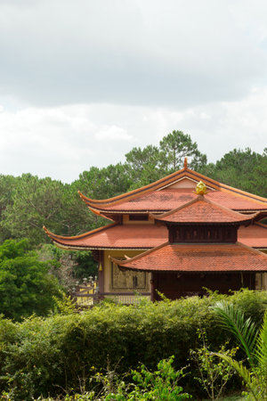 Majestic Pagoda Amidst Verdant Foliage. Asian Temple Landscape and Architecture. Dalat, Vietnam.