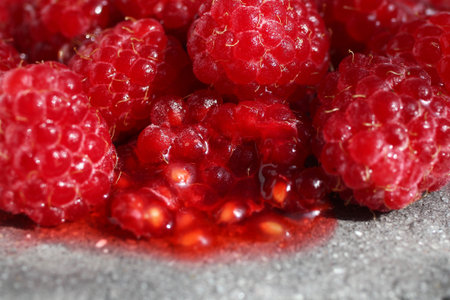 Fresh Sweet Raspberries Bursting with Flavor. Delicious and Nutritious Summer Treat, Close-Up View.