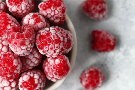 Top View of Iced Raspberries. Close-Up of Frozen Fruit for Healthy Eating and Delicious Desserts.