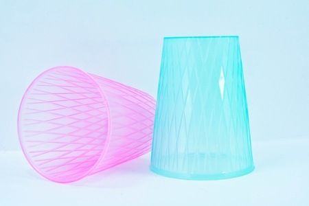 pink and blue plastic glass on white isolatedの写真素材