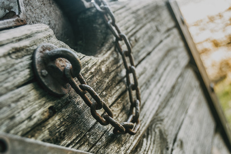 Old chains on an old piece of wood
