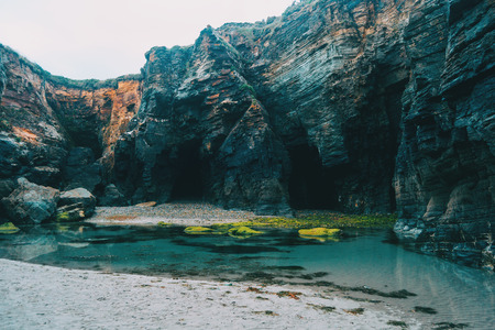 Beach with moss stones, ribadeo, lugo, galician, spainの写真素材