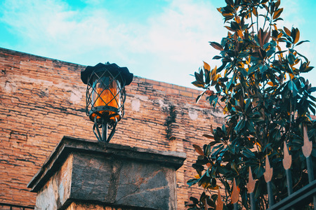 lamp in the column of a house on a cloudless dayの写真素材