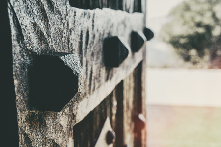 Closeup of forging details of an old wooden door with perspectiveの写真素材