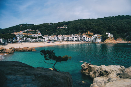 Beach in a town on the Costa Brava, Catalonia, Spain. the sea has crystal clear water and has a trampolineのeditorial素材