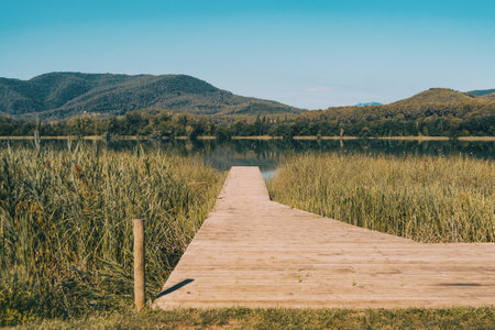 View of Banyoles Lake, in Gerona (Catalonia, Spain) with clear and blue skies on a sunny dayの写真素材