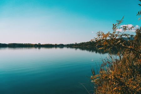 View of Banyoles Lake, in Gerona (Catalonia, Spain) with clear and blue skies on a sunny dayの写真素材