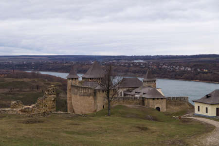 View of the ancient fortress in the city of Khotyn and the Dniester River in winter, Ukraine