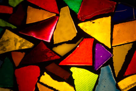 Multicolored background: mosaic of backlit glass pieces painted in different colorsの写真素材