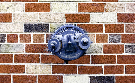 Fire Hydrant in the wall の写真素材