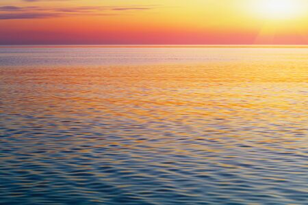 scenic ocean landscape, golden sunset or sunrise at sea