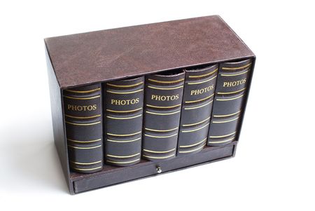 Five photo books in mini bookcase isolated on white backgroundの写真素材