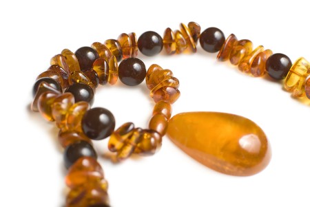 Amber necklace close-up isolated on white backgroundの写真素材