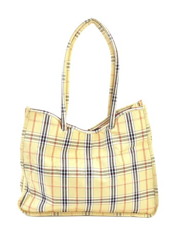 Yellow shopping bag. Isolated on white background.の写真素材