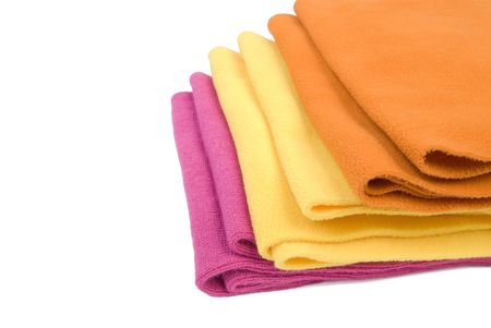Colorful stack of winter scarfs. Isolated on white backgroundの写真素材