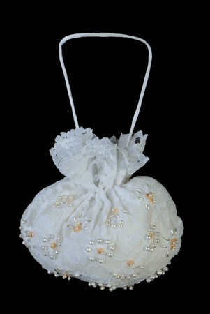 Small female pouch with laces and floral ornament. Isolated on black backgroundの写真素材