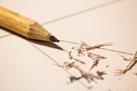 A pencil on a sheet that was scrubbed by a rubberの写真素材