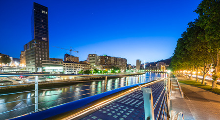 a view of Bilbao river from Calatrava Bridge to the center of the cityの写真素材