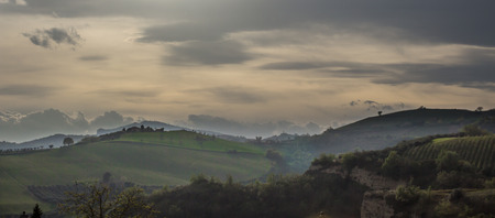 a view of the countryside in a cloudy spring evening