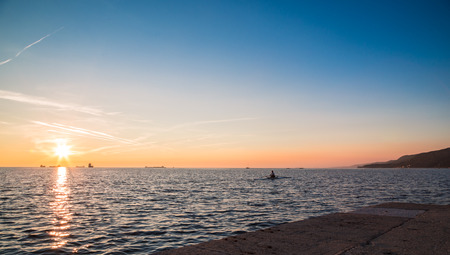 with a kayak in the bay of Triesteの写真素材